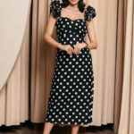 Φόρεμα midi πουά μαύρο με βολάν στους ώμους